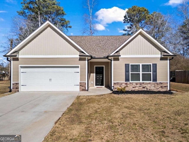 view of front of property with a garage and a front yard