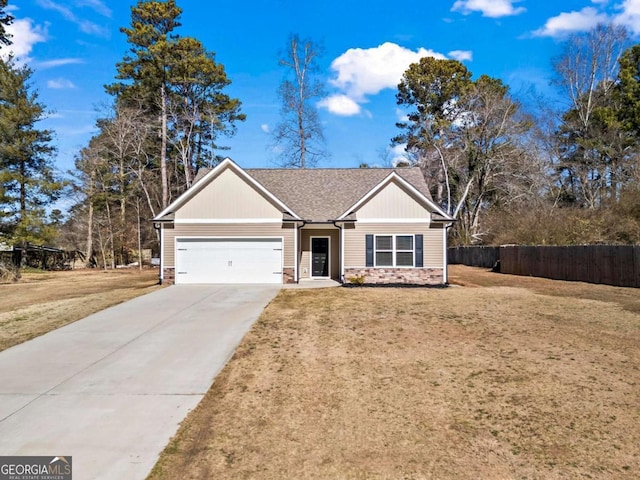 single story home with a garage and a front lawn