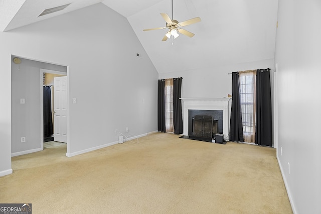 unfurnished living room featuring ceiling fan, high vaulted ceiling, and light carpet