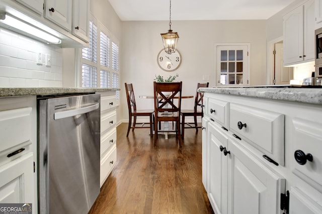 kitchen with white cabinets, dishwasher, light stone countertops, decorative backsplash, and dark wood-style flooring