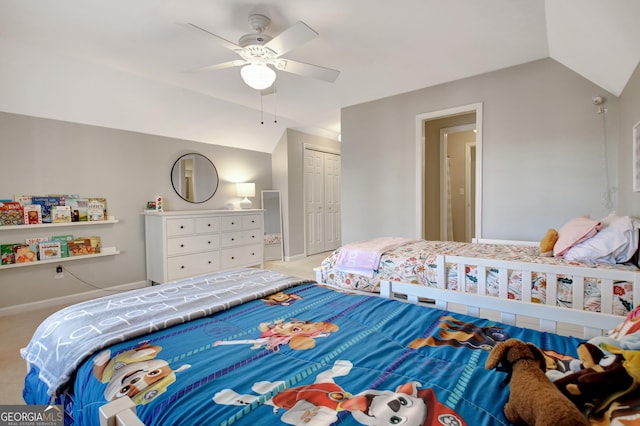 bedroom with a closet, lofted ceiling, and carpet floors