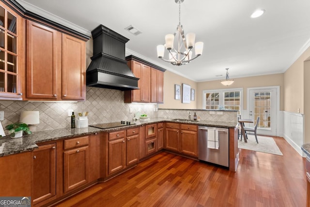 kitchen with pendant lighting, crown molding, dishwasher, black electric stovetop, and custom range hood