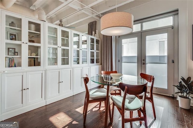 dining space featuring plenty of natural light, dark wood-type flooring, and french doors