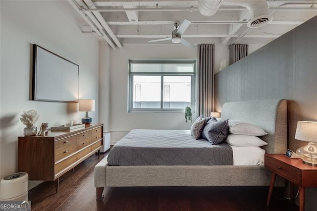 bedroom with ceiling fan and dark hardwood / wood-style flooring