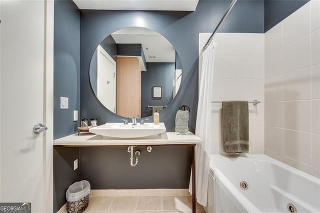 bathroom with shower / tub combo, tile patterned flooring, and sink