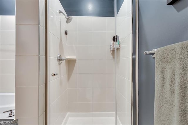 bathroom featuring an enclosed shower