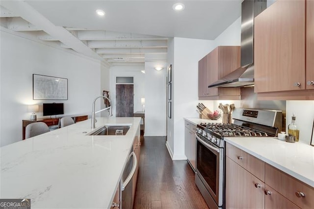 kitchen featuring wall chimney exhaust hood, sink, dark hardwood / wood-style floors, stainless steel appliances, and light stone countertops