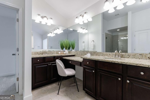 bathroom featuring tile patterned floors, lofted ceiling, an enclosed shower, and vanity