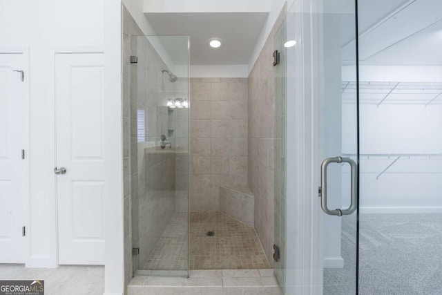 bathroom with a shower with shower door