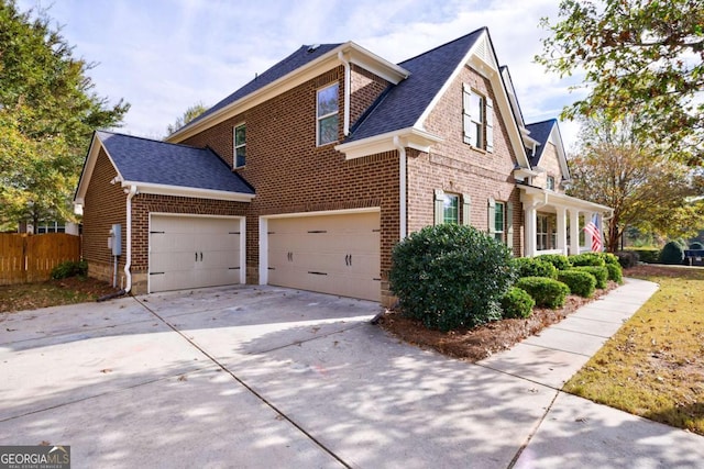 view of side of property featuring a garage