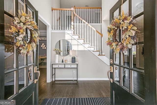 entrance foyer featuring dark hardwood / wood-style floors