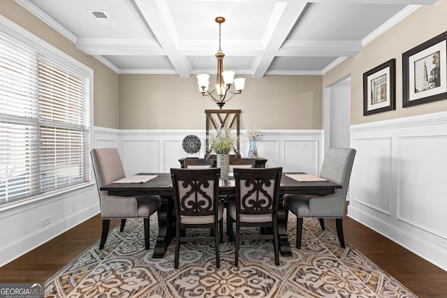 dining room featuring beamed ceiling, wood-type flooring, coffered ceiling, and a chandelier