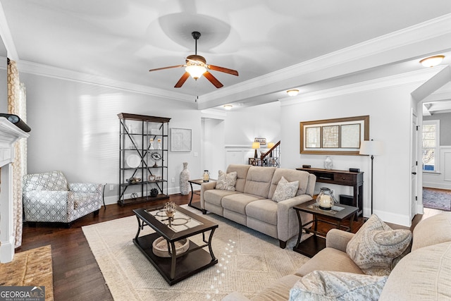 living room with wood-type flooring, ceiling fan, and crown molding