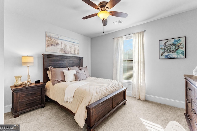 carpeted bedroom with ceiling fan