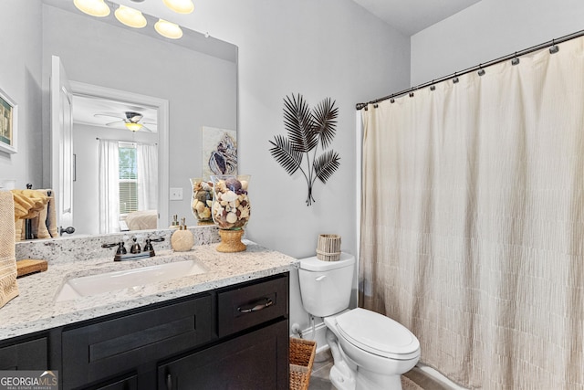 bathroom with vanity, ceiling fan, and toilet