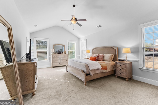 bedroom with light carpet, vaulted ceiling, and ceiling fan