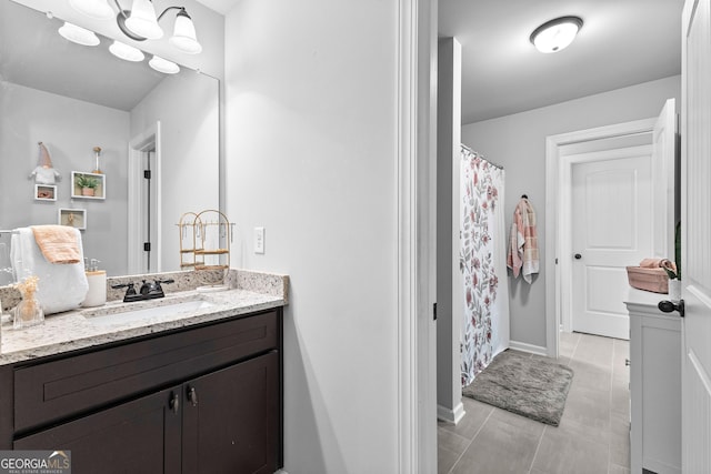 bathroom featuring vanity and a shower with shower curtain