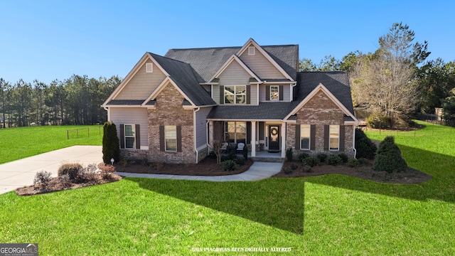 craftsman house featuring a front yard and covered porch