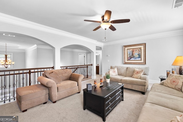 carpeted living room featuring an inviting chandelier and ornamental molding