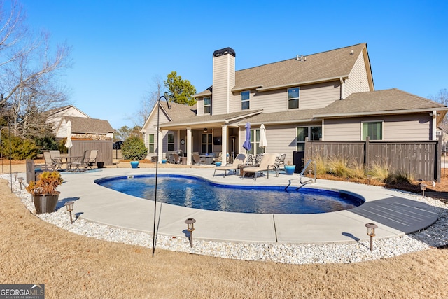 view of swimming pool with a patio