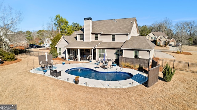 view of pool with a yard and a patio area