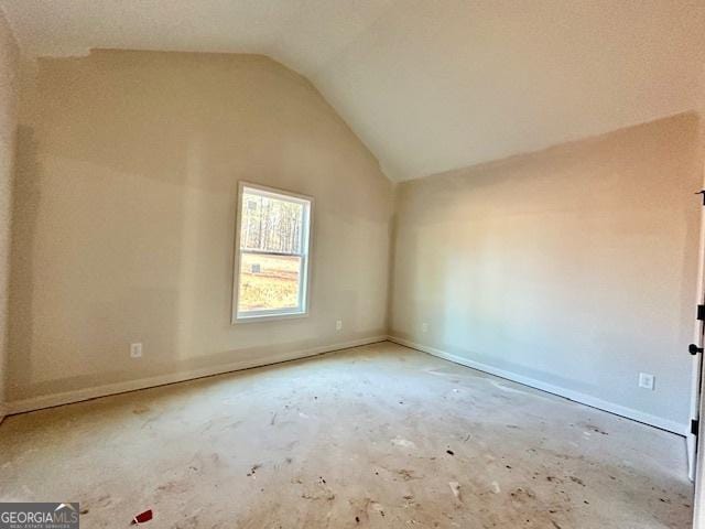 additional living space with vaulted ceiling