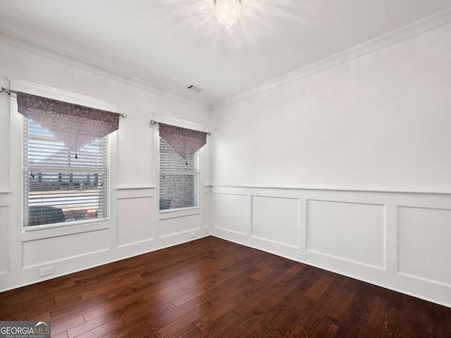unfurnished room with dark hardwood / wood-style flooring and ornamental molding