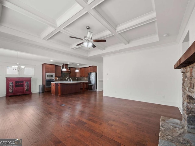 unfurnished living room with coffered ceiling, dark hardwood / wood-style floors, ceiling fan with notable chandelier, and a fireplace