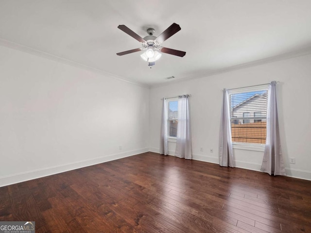 unfurnished room with dark wood-type flooring, ceiling fan, and ornamental molding