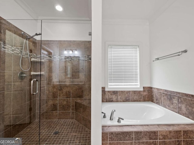 bathroom featuring crown molding and plus walk in shower