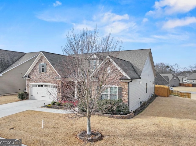 view of front of home featuring a garage and a front yard