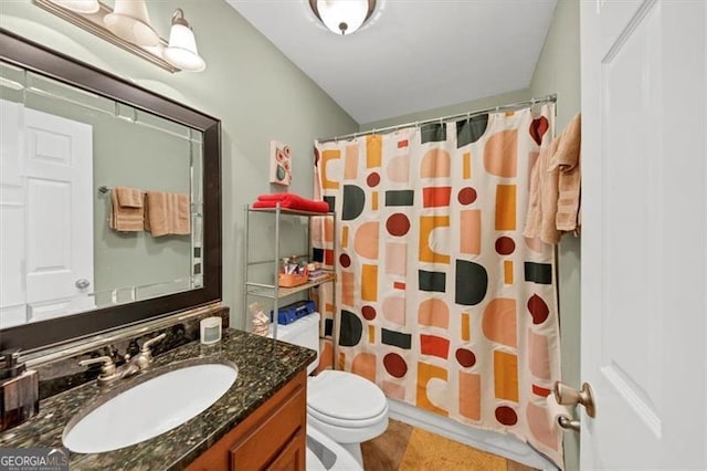 full bathroom featuring shower / bathtub combination with curtain, vanity, toilet, and tile patterned floors