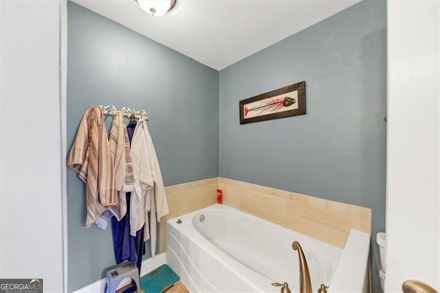 bathroom with a bathtub and toilet