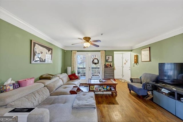 living room with hardwood / wood-style floors, crown molding, french doors, and ceiling fan