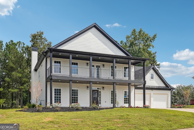 view of front facade featuring concrete driveway, a standing seam roof, metal roof, a balcony, and a front lawn