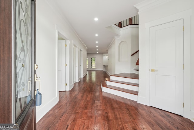 entrance foyer with stairs, recessed lighting, dark wood finished floors, and crown molding