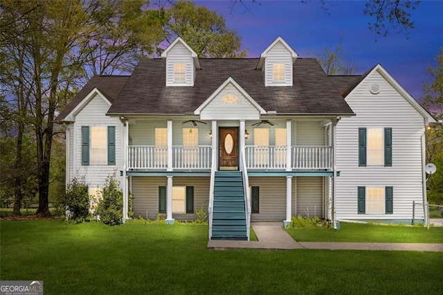 exterior space with covered porch and a lawn