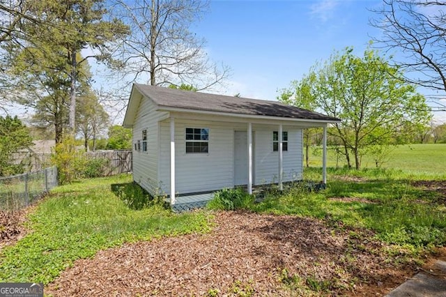 view of outbuilding with a lawn