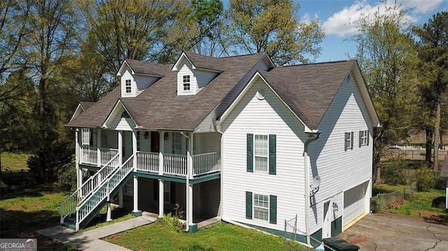 view of front of home with a garage and covered porch