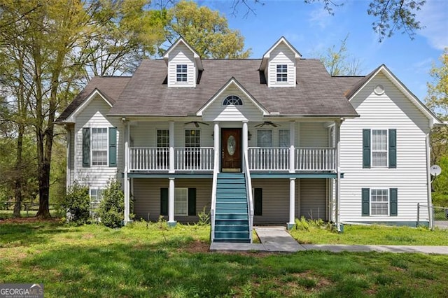 view of front facade with a front lawn and covered porch