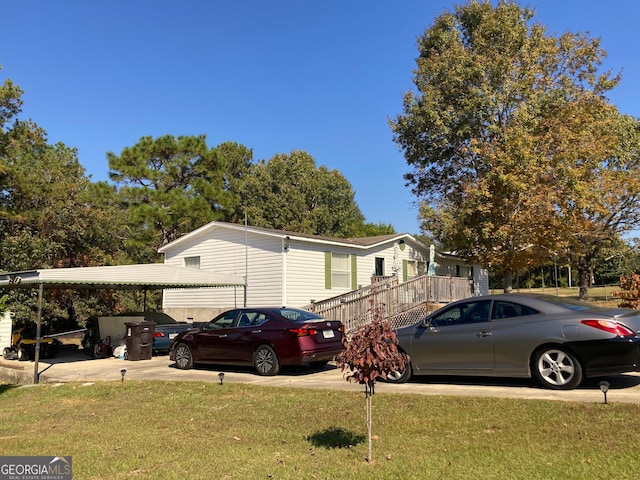 view of home's exterior featuring a carport and a lawn