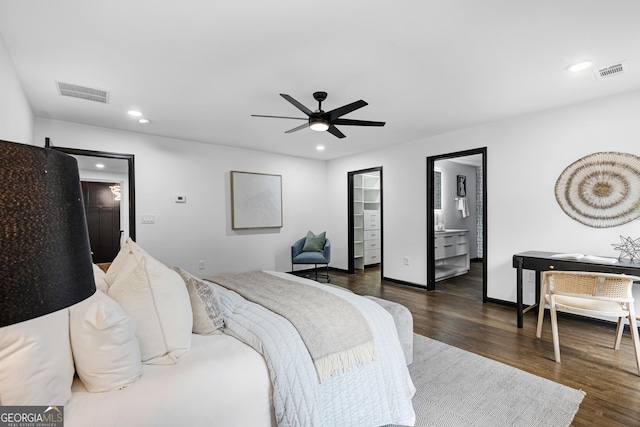 bedroom featuring dark wood-type flooring, ceiling fan, and ensuite bathroom