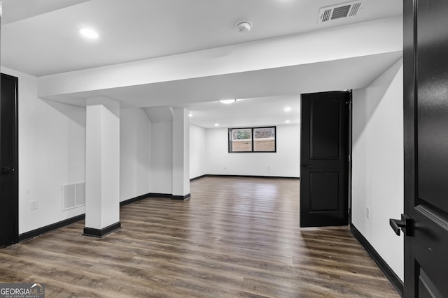 basement featuring dark wood-type flooring