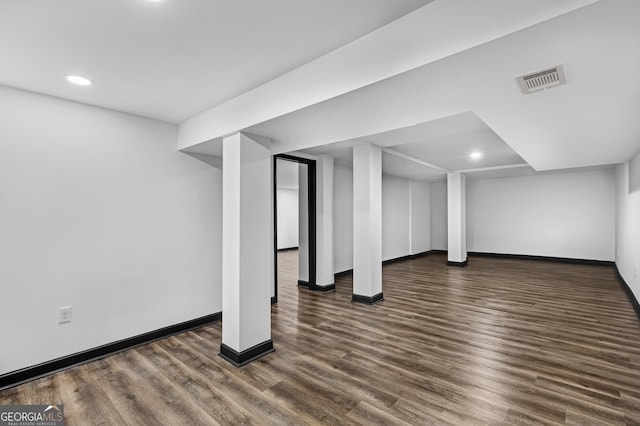 basement with dark wood-type flooring