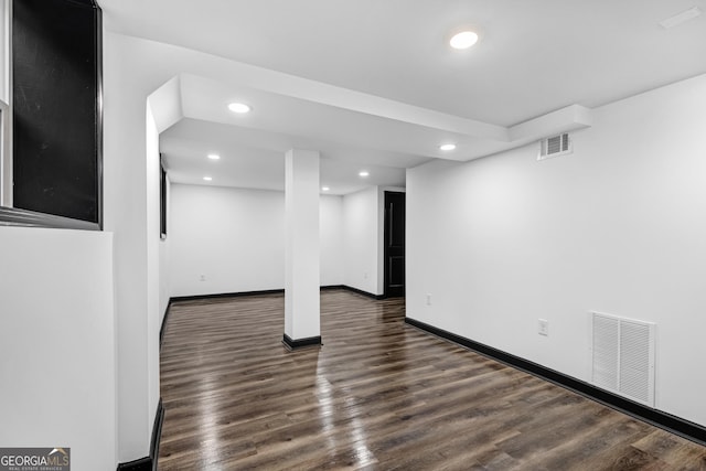 basement with dark wood-type flooring