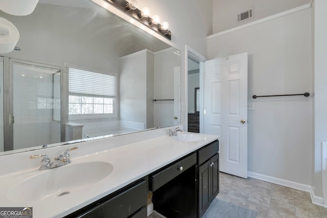 bathroom with vanity and separate shower and tub