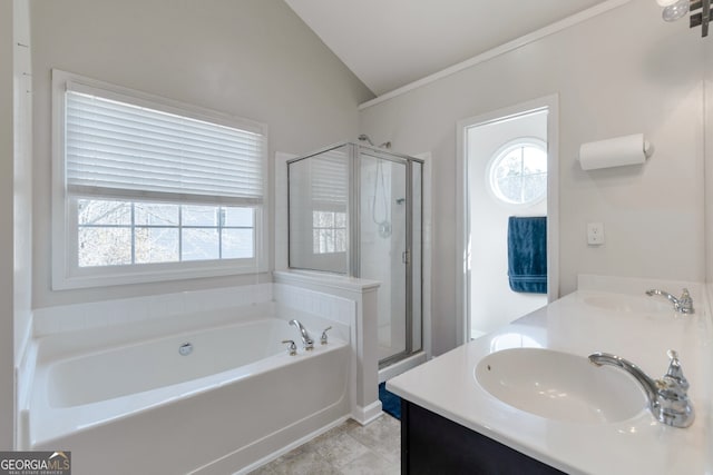 bathroom featuring lofted ceiling, vanity, independent shower and bath, and tile patterned flooring