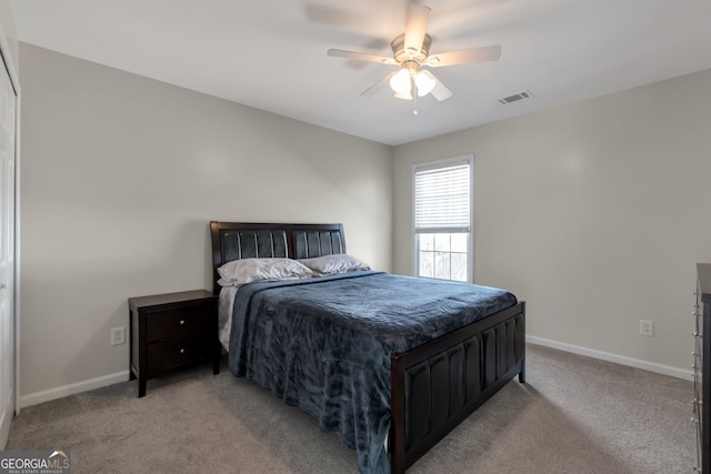 bedroom with light carpet and ceiling fan