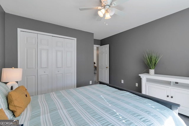 bedroom with ceiling fan and a closet