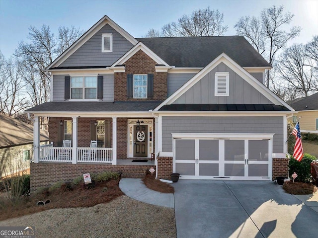 craftsman inspired home featuring a garage and covered porch